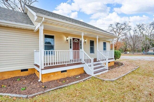 doorway to property featuring covered porch