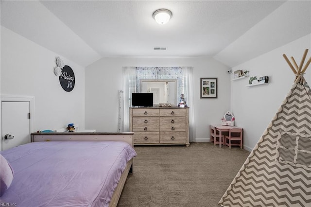 bedroom with carpet floors and vaulted ceiling