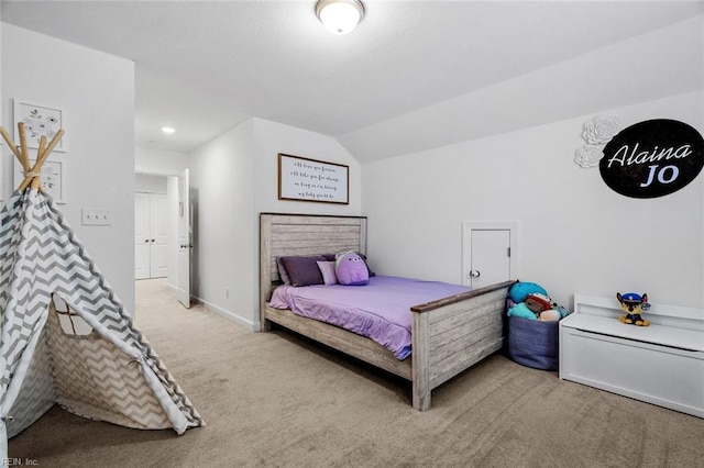 carpeted bedroom featuring vaulted ceiling