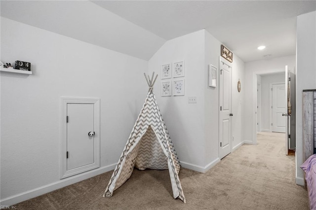 game room featuring light carpet and lofted ceiling