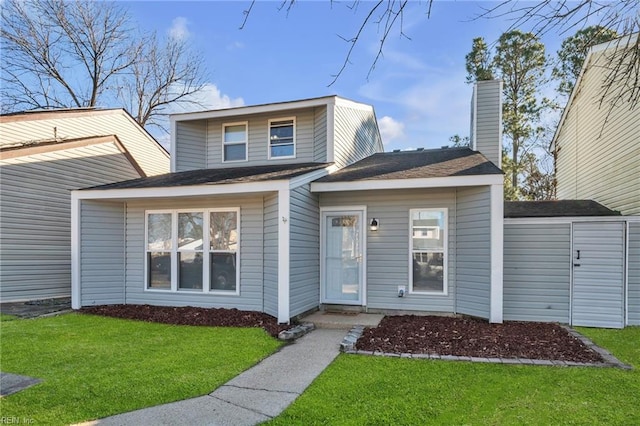 view of front of home with a front yard