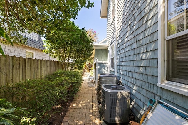 view of property exterior with central AC