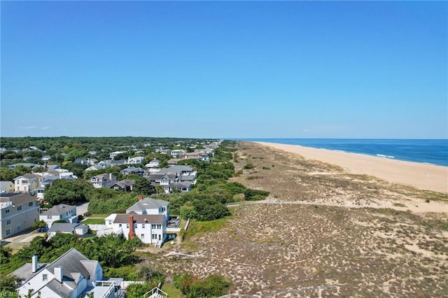 bird's eye view featuring a water view and a beach view