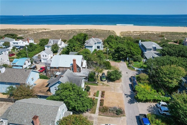 bird's eye view featuring a water view and a view of the beach