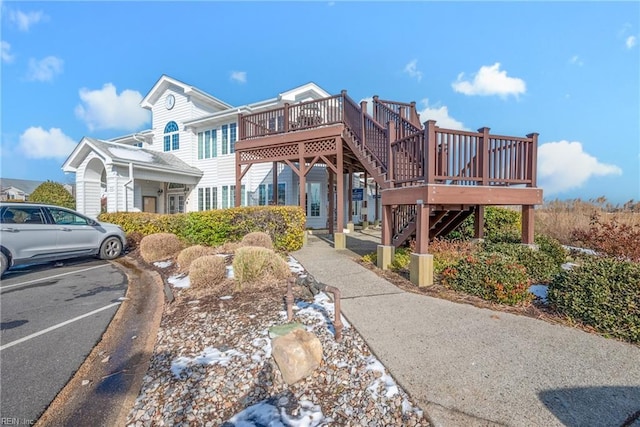 view of property featuring a wooden deck