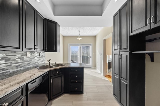 kitchen featuring pendant lighting, sink, black dishwasher, light stone counters, and decorative backsplash