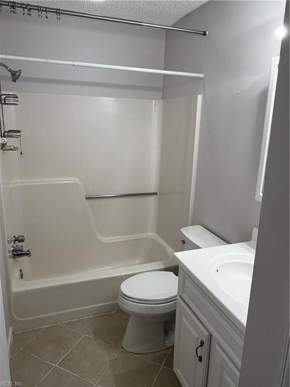 full bathroom with tile patterned flooring, vanity,  shower combination, and toilet