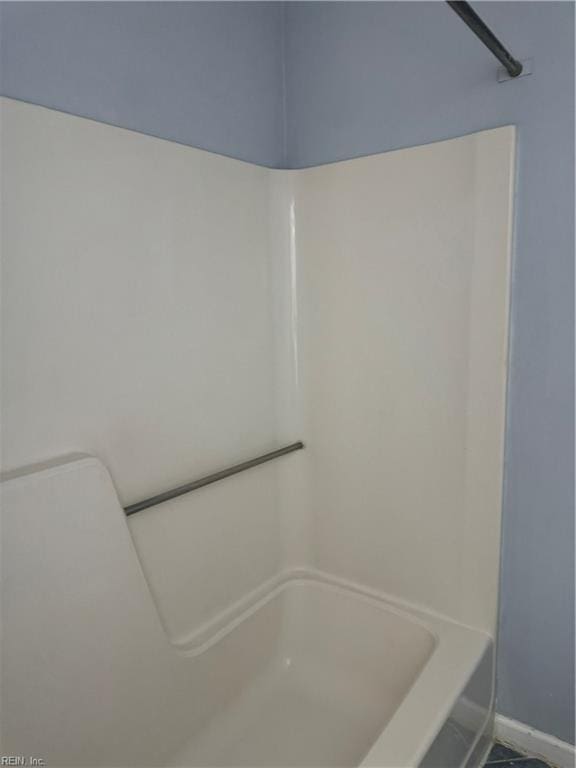 bathroom featuring tile patterned floors and tub / shower combination