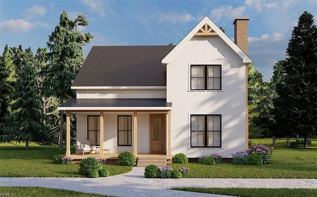 rear view of house featuring a yard and covered porch