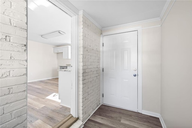 foyer entrance featuring light hardwood / wood-style floors and ornamental molding