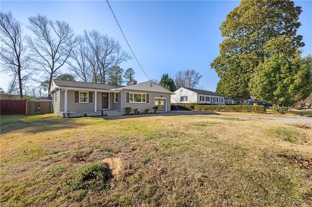 single story home featuring a front lawn