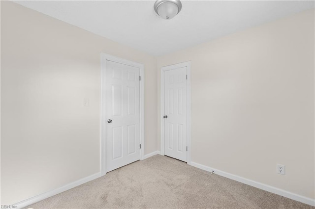 spare room with light carpet