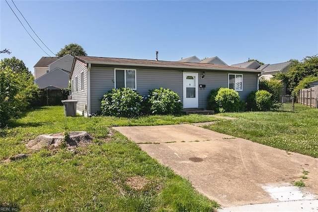 view of front of home with a patio and a front yard