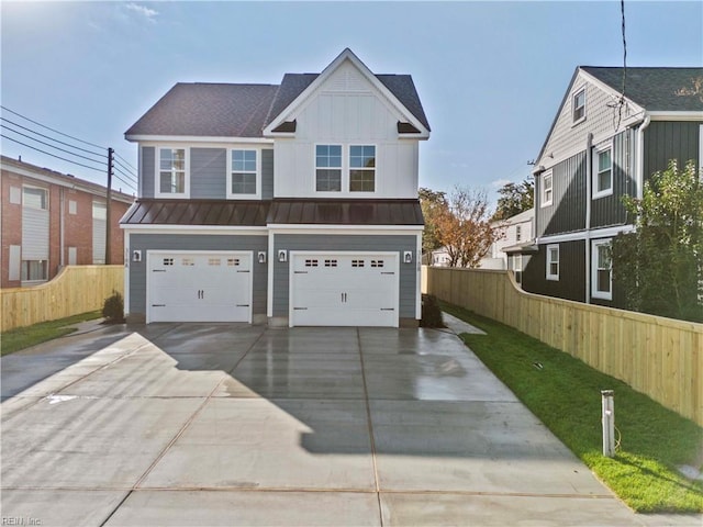 view of front of home featuring a front yard and a garage