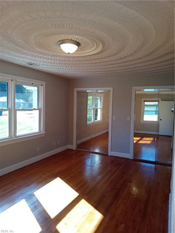 empty room with hardwood / wood-style floors