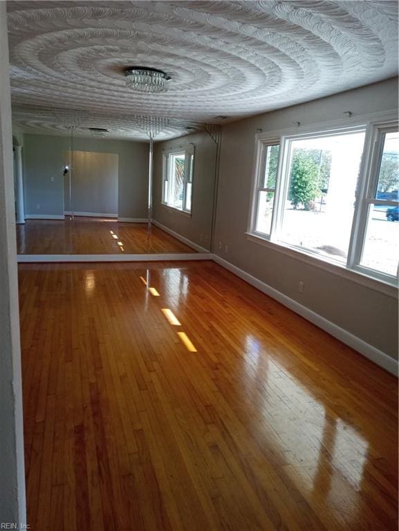 unfurnished room featuring hardwood / wood-style floors