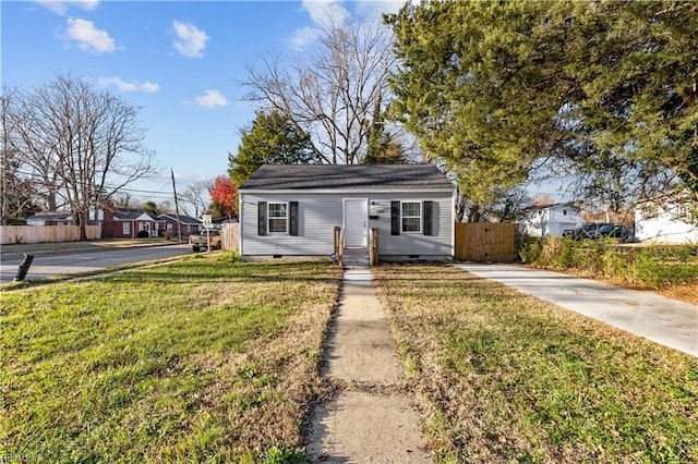 bungalow with a front yard