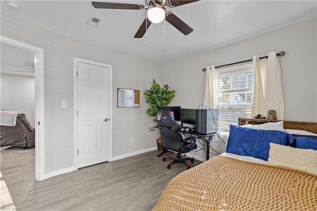 bedroom featuring ceiling fan and light wood-type flooring