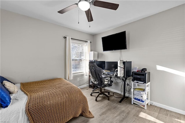 bedroom with ceiling fan and light hardwood / wood-style flooring