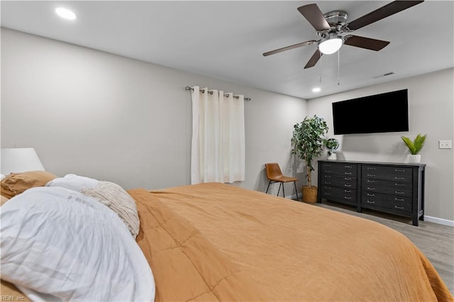 bedroom featuring ceiling fan and wood-type flooring