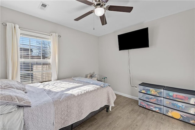 bedroom featuring ceiling fan and light hardwood / wood-style flooring