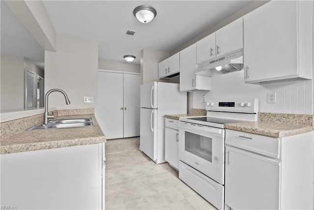 kitchen with backsplash, sink, white cabinets, and white appliances