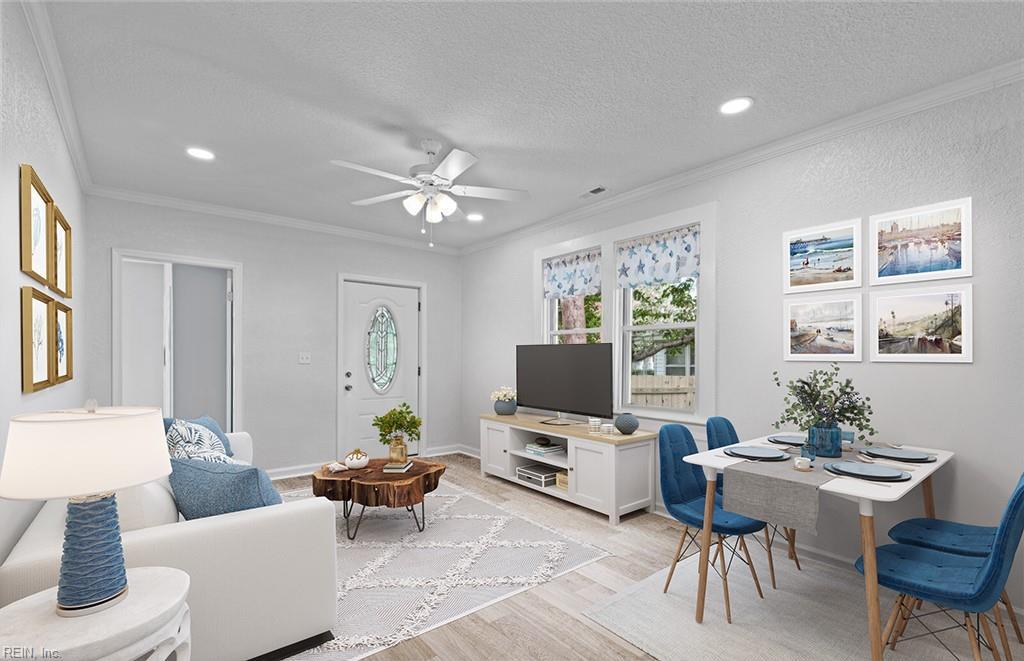 living room with ceiling fan, ornamental molding, a textured ceiling, and light hardwood / wood-style flooring