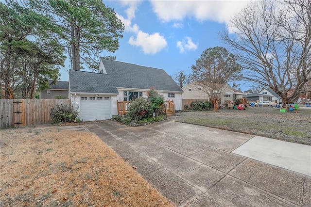 view of front of house with a garage and a front lawn