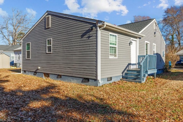 view of home's exterior with a yard