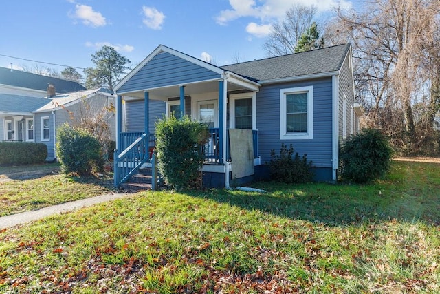 view of front of house with a front lawn and covered porch