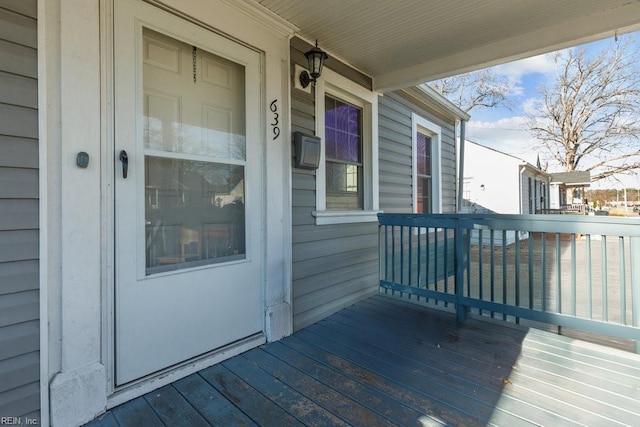 wooden deck featuring covered porch