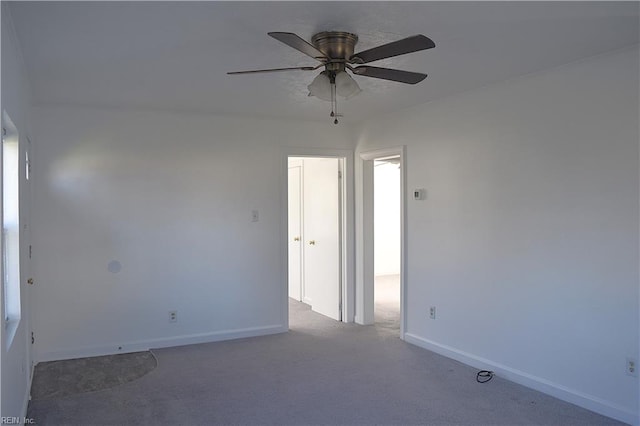 unfurnished room featuring ceiling fan and carpet floors