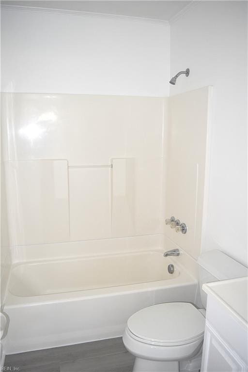 full bathroom with vanity, toilet, wood-type flooring, and tub / shower combination