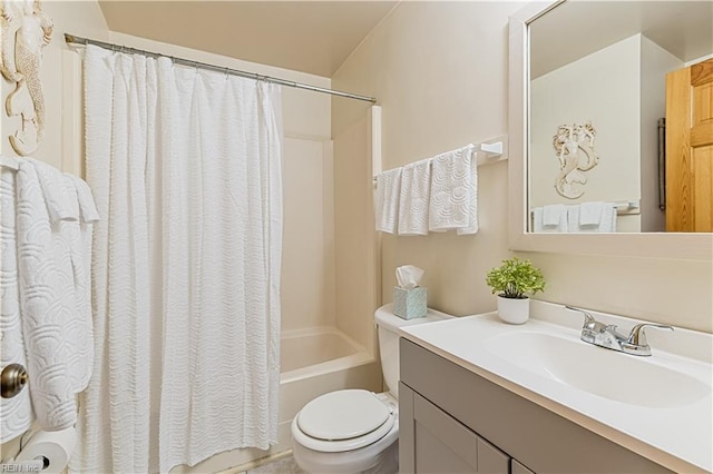 bathroom featuring shower / bath combination with curtain, toilet, and vanity