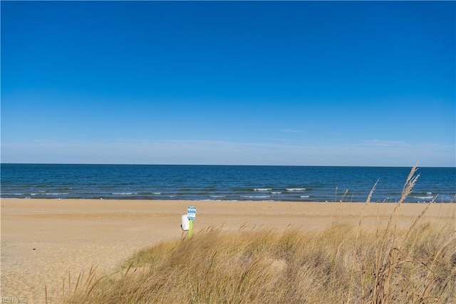 view of water feature with a beach view