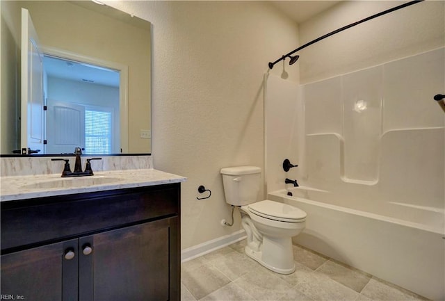 full bathroom featuring vanity, bathtub / shower combination, and toilet