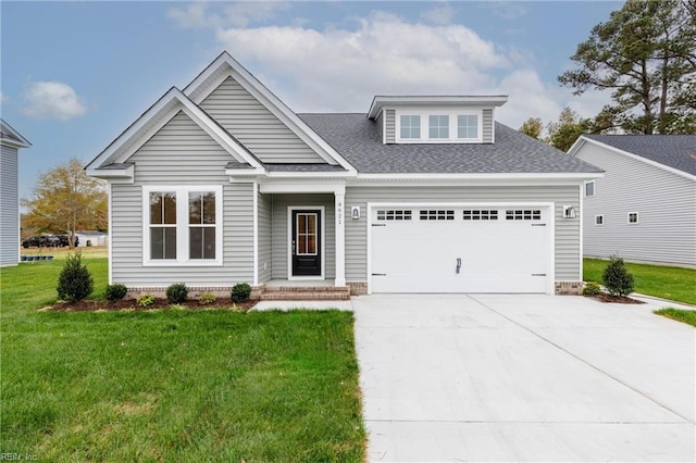 craftsman house featuring a garage and a front lawn