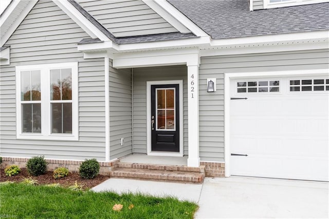 doorway to property featuring a garage