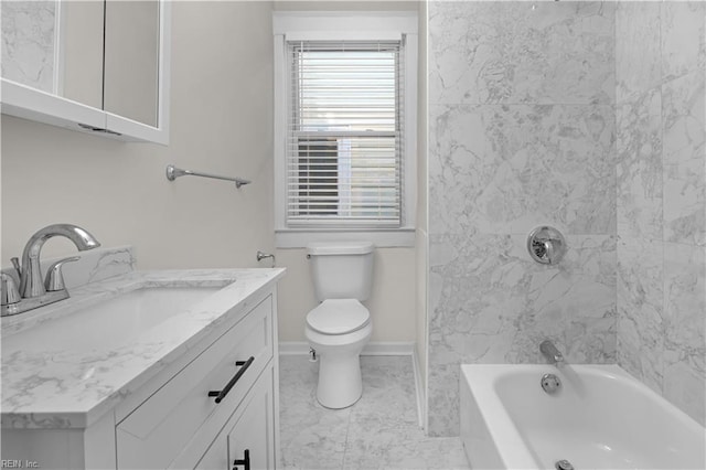 full bathroom featuring vanity, tiled shower / bath combo, and toilet