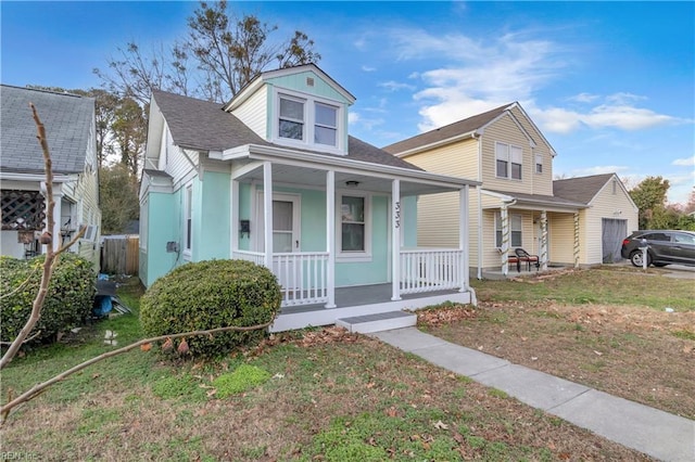 bungalow-style house with a front yard and a porch