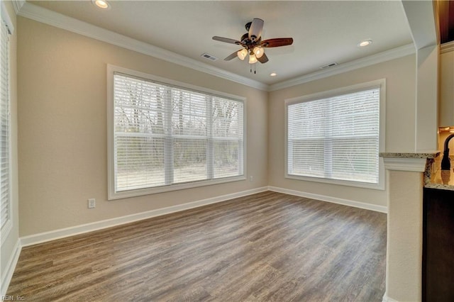 unfurnished dining area featuring wood-type flooring, ceiling fan, and crown molding