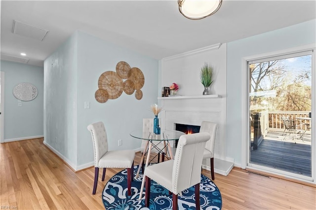 dining room with hardwood / wood-style floors