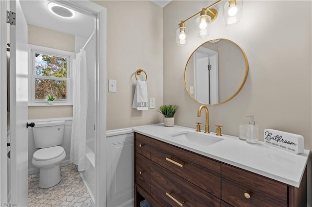 full bathroom featuring tile patterned flooring, vanity, toilet, and shower / tub combo with curtain