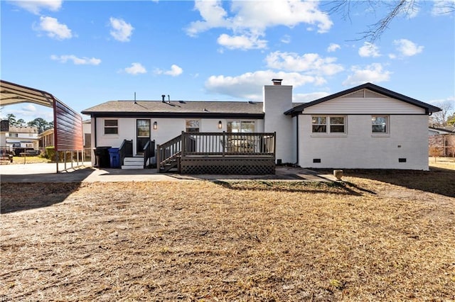 rear view of house featuring a wooden deck