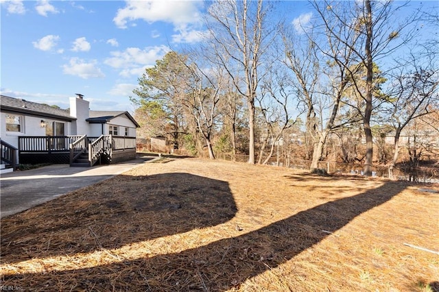 view of yard featuring a deck