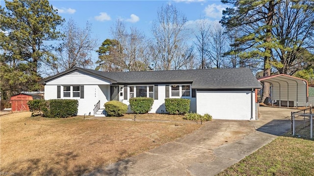 ranch-style home with a garage, a front yard, and a carport