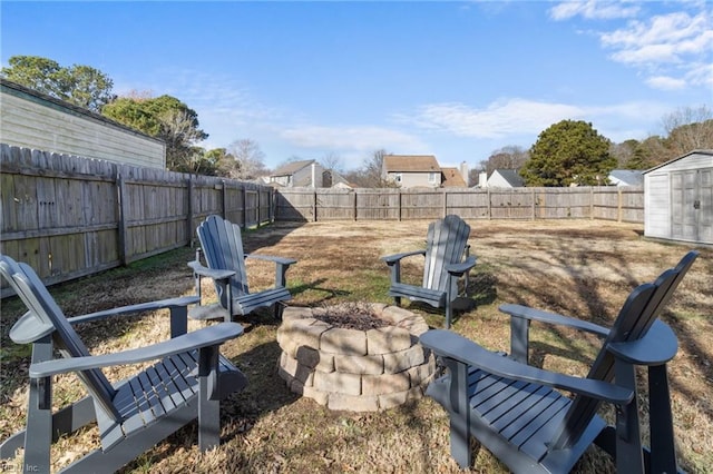 view of yard with an outdoor fire pit