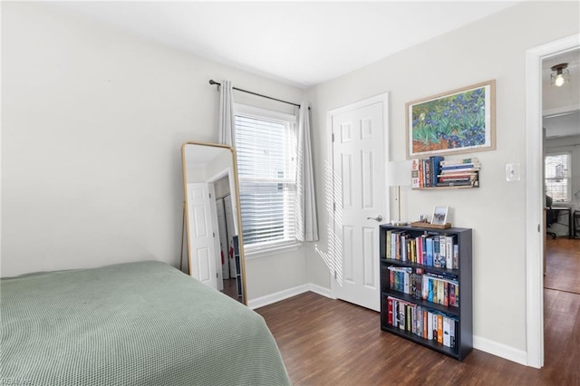 bedroom featuring dark hardwood / wood-style flooring