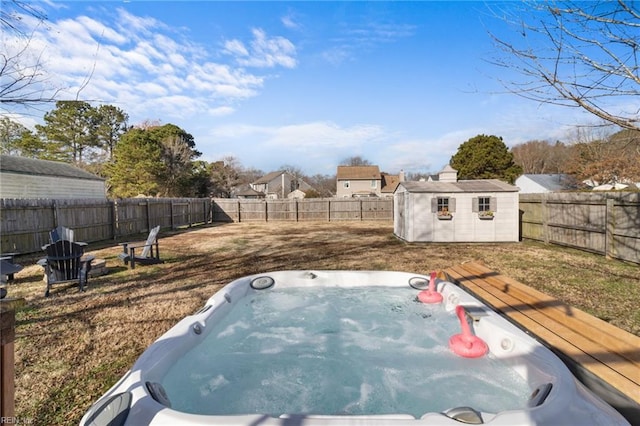 view of yard with a deck, a hot tub, and a storage unit