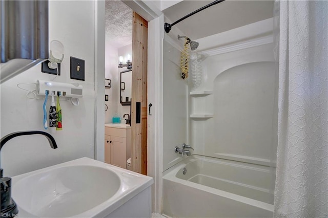 bathroom with shower / bath combo and vanity